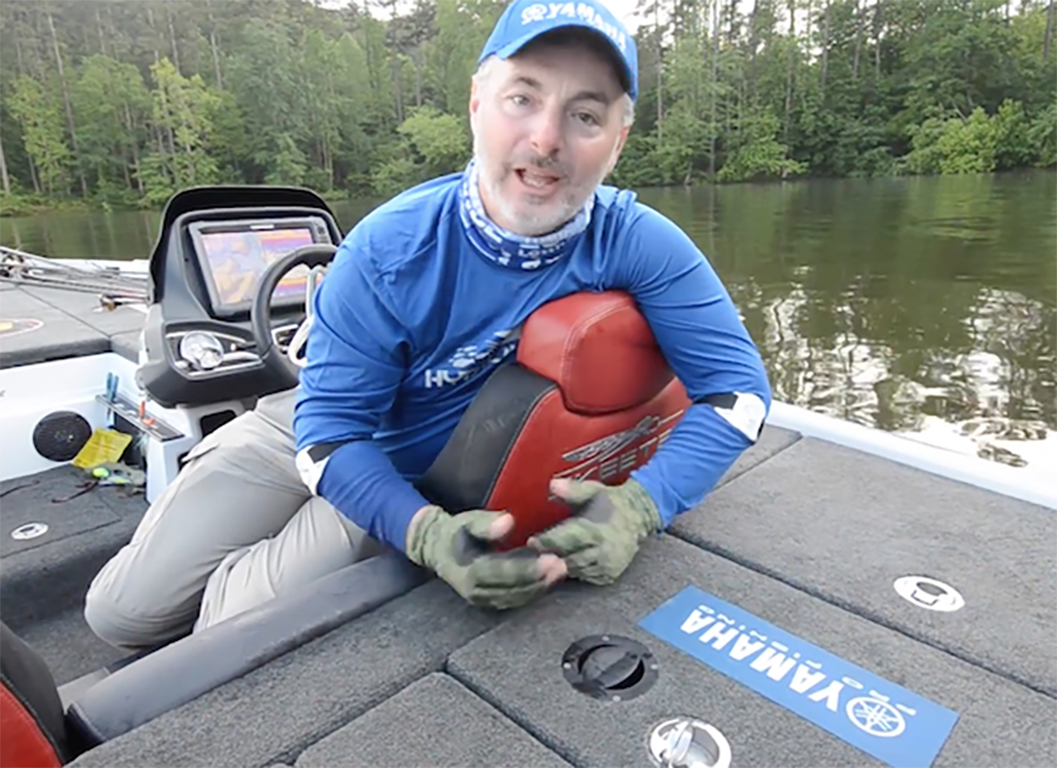 Mark Menendez demonstrating the V-T2 livewell ventilation system on a Skeeter bass boat